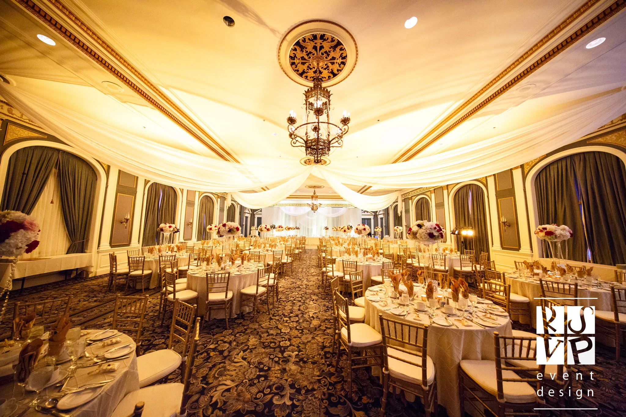 A classic and elegant Gold Wedding in Adam Ballroom was complete with warm lighting and stunning floral arrangements by Blossoms Living. Photo: Chris Graham Photography