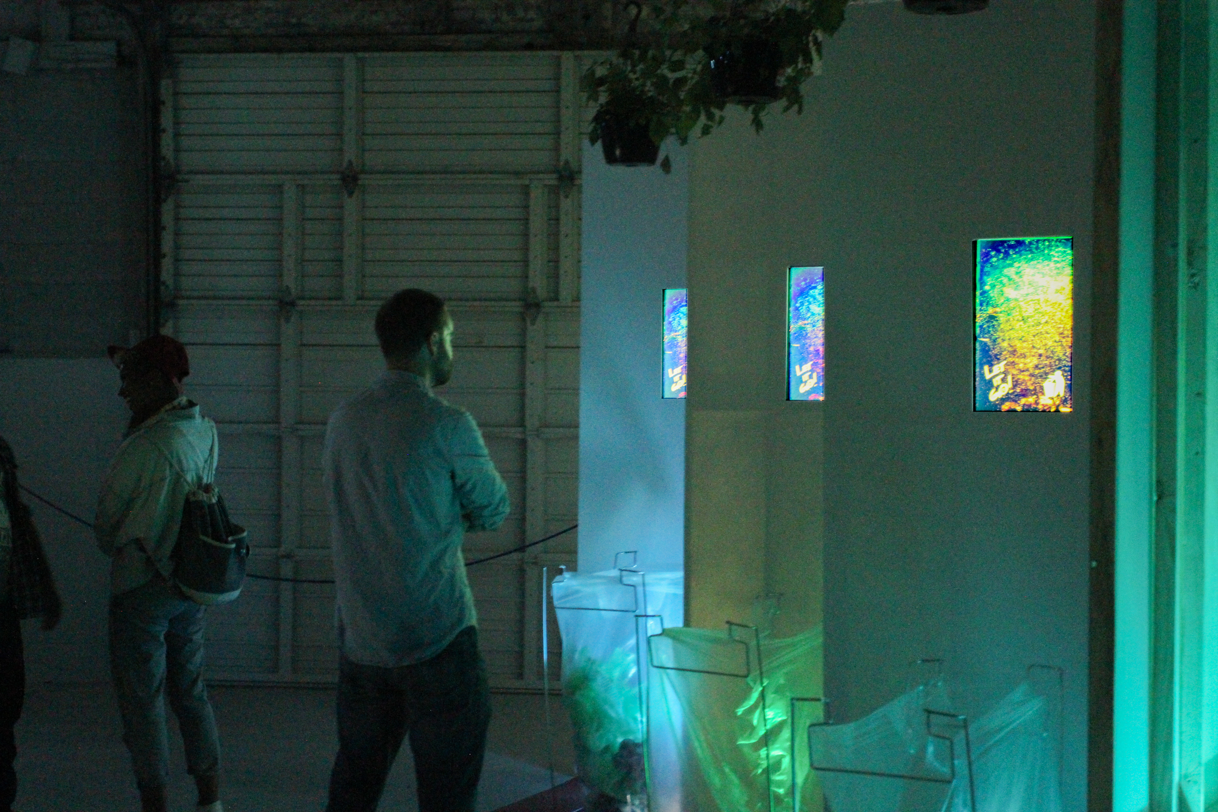 Shakedown Dave Greber. 2016. Wood, GatorPlas, (3) flat screen monitors, HDMI media player, looped video (3:41m), speaker pendant and amplifier, (3) ivy plants, three lamps Dimensions: 15 x 5 x 8 feet