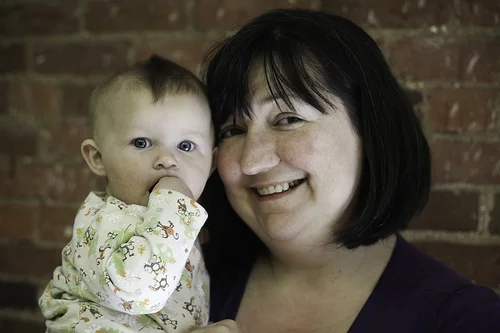 “Ypsi Project : Liz Dahl MacGregor and Maggie (by ericarhiannon )
Liz lives in Ypsi with her husband and two children; Maggie is pictured here (the one with the awesome baby-hawk) with her Mom and her son Gabriel is pictured separately. She studied humanities at WCC, then moved on to EMU for her degree. She traveled to St. Louis to attend law school, then came home to Ypsi. After practiced for a couple of years she had to stop due to health issues while pregnant with her son, Gabriel. Now she spends her time taking care of Maggie and Gabriel, working as the office manager at Growing Hope, serving on the board of the Ypsilanti Food Co-op, and trying to figure out how to transition to a lower energy lifestyle through working with the Transition Town initiative. I’m just guessing, but I think she’s really busy ;)
