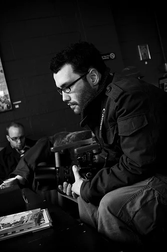 Ypsi Project : Chris Asadian (via ericarhiannon )
Chris is the photo editor for The Washtenaw Voice , a student run paper for Washtenaw Community College. He took my photo today for an interview I did with his colleague, Elizabeth. Chris is also studying Photographic Imaging at WCC. You can see some of his work on his myspace page. It’s definitely worth a look. Oh, and he drives an ice cream truck during the summer :) On a side note, it is my personal opinion that WCC has an excellent array of classes and instructors in regards to all things photography. I secretly wish I had studied there instead of EMU.