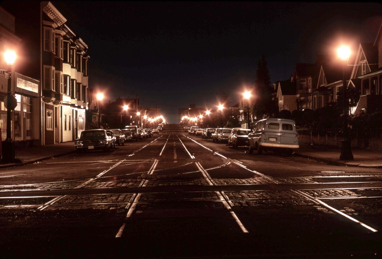 Georgia Street looking west from Campbell Avenue. Incandesent post top streetlights by night.