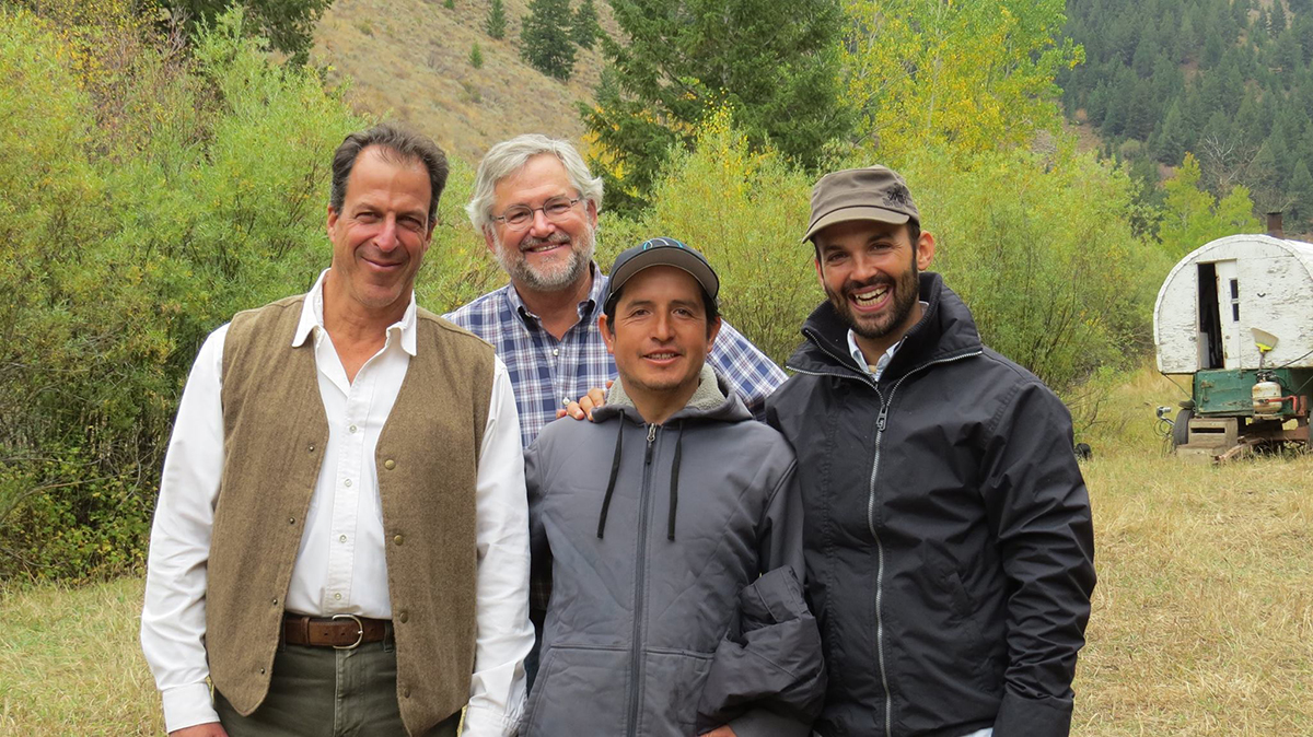 From left: Larry Schoen (Blaine County Commissioner), Brian Bean (owner of Lava Lake Land & Livestock and President of the Lava Lake Institute for Science & Conservation), Roberto (sheep herder from Flat Top Ranch), and Fernando Najera (WRWP Project Field Manager in 2014). Photo: Defenders of Wildlife