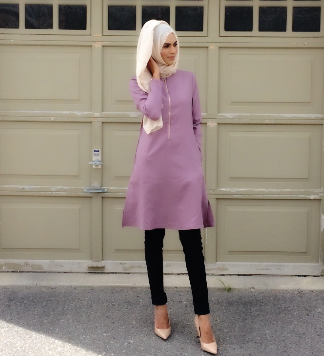 Effortless and comfortably stylish. This mauve long tunic ($45) falls just above the knee and looks & feels great with a comfy pair of leggings. A light and breathable viscose hijab in ivory ($15) with pearl trim is a wardrobe staple that can make the simplest ensemble look elegant. Zaheera has selected a pair of nude pumps to finish her look but a cozy pair of flats look great or knee high boots in the fall. Tunic & hijab by Hijabi Mama available at The Date Palm