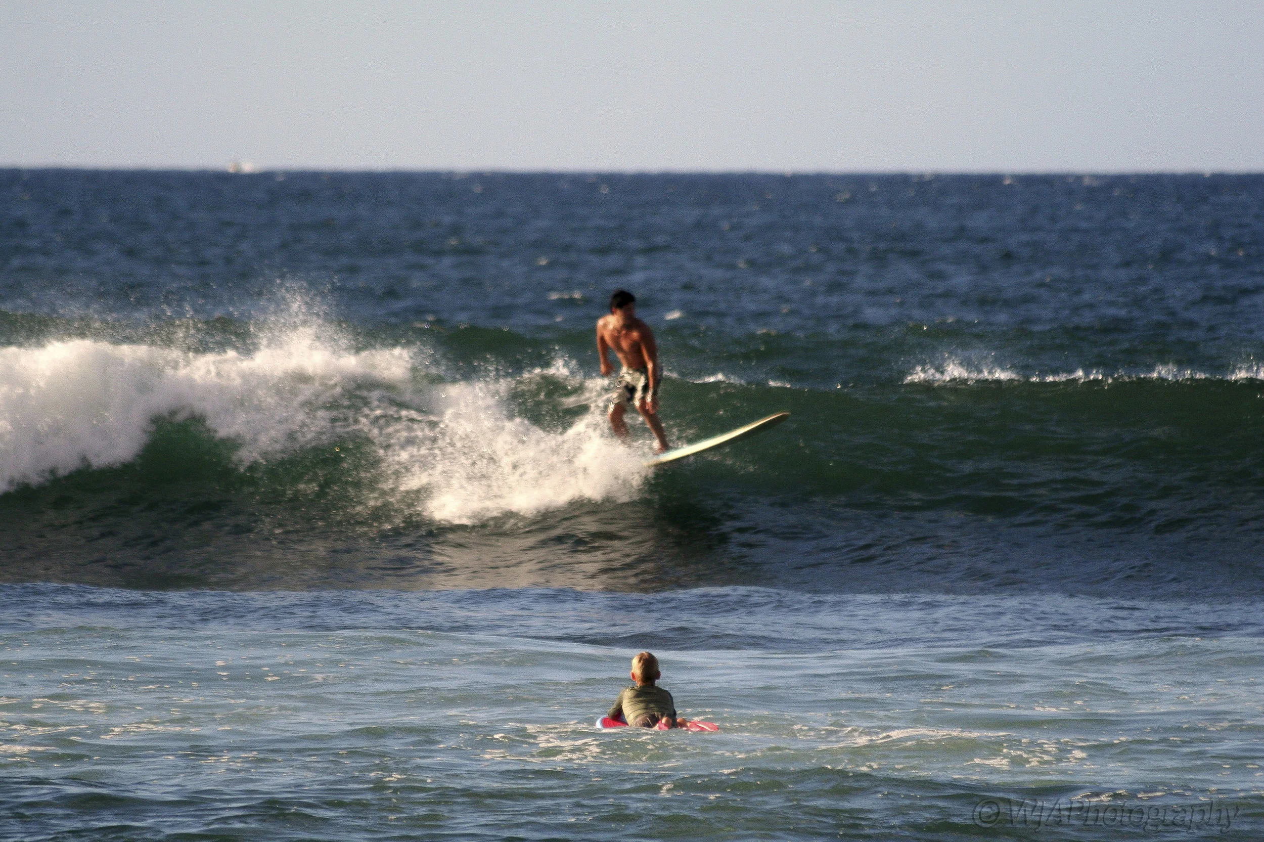 young surfer watchin old surfer.JPG