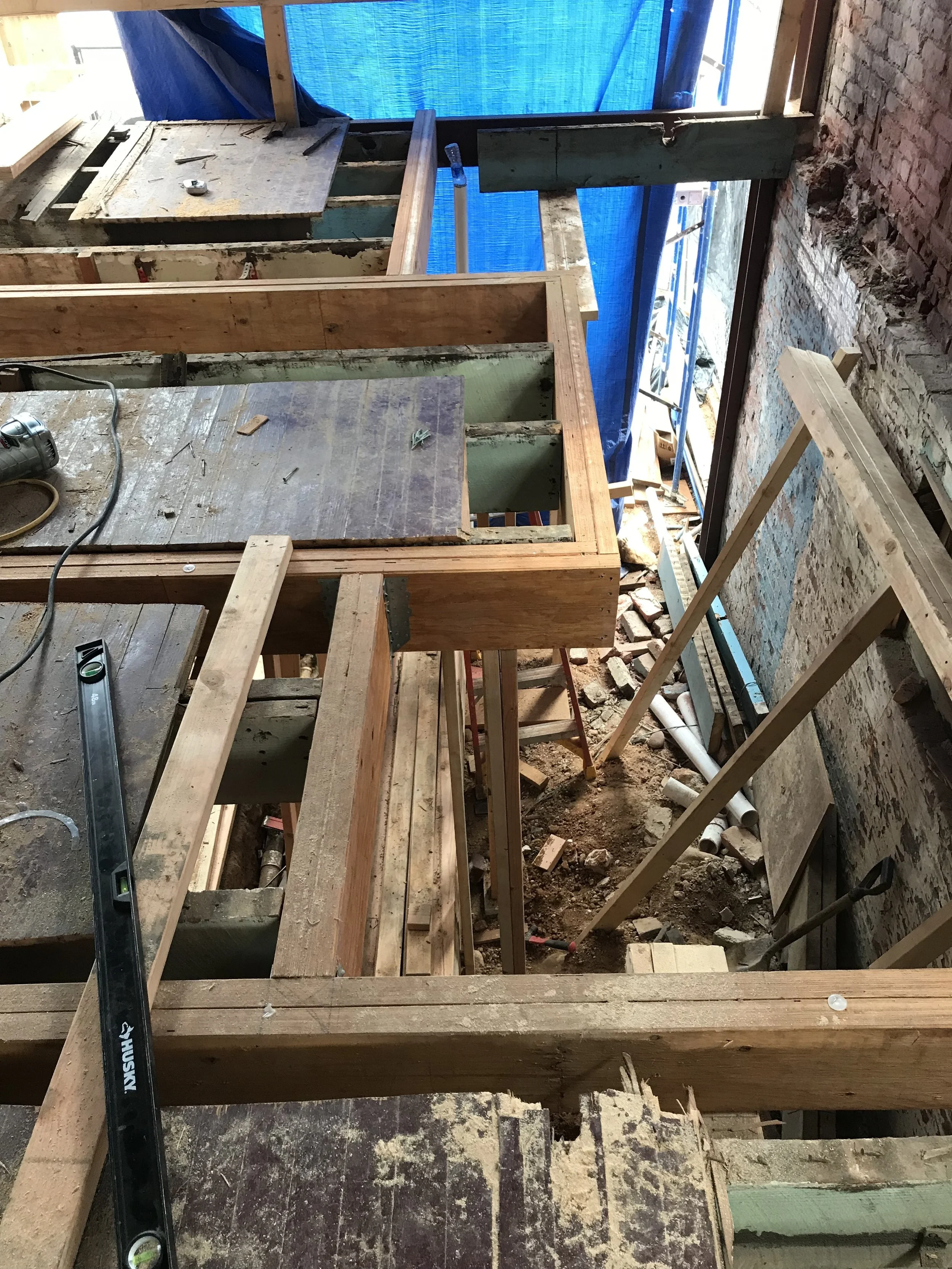 The new beams forming the opening for the new stairway