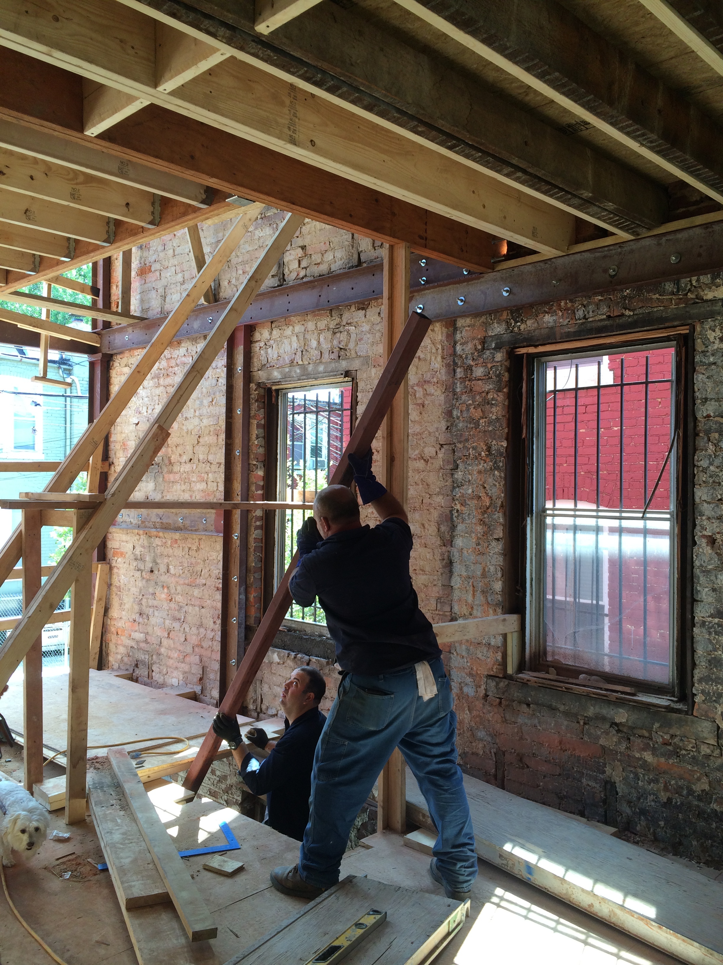 Steel fabrication contractor on site installing steel frame.