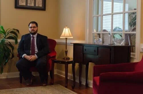 Adam+Lilly+in+the+office+of+The+Lilly+Law+Firm+in+Cumming,+Georgia.jpg