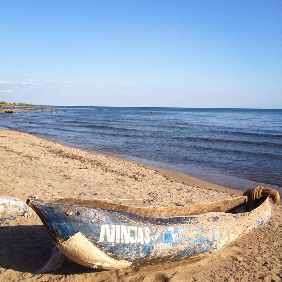 Old canoe on beach.jpg