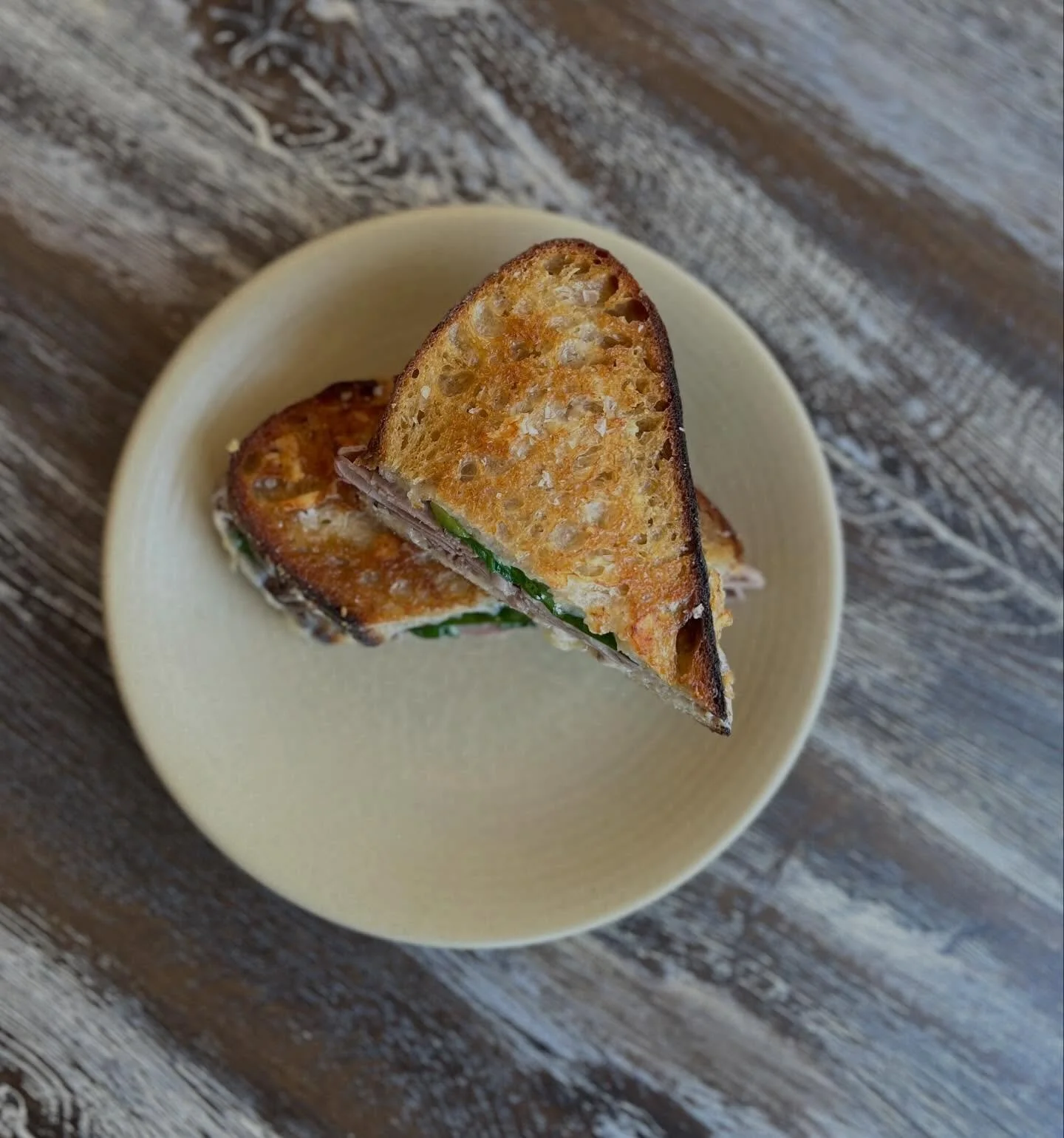 Lunch Special! Roast beef on grilled sourdough, smoked cheddar cheese, horseradish cr&egrave;me fraiche, ramp tops