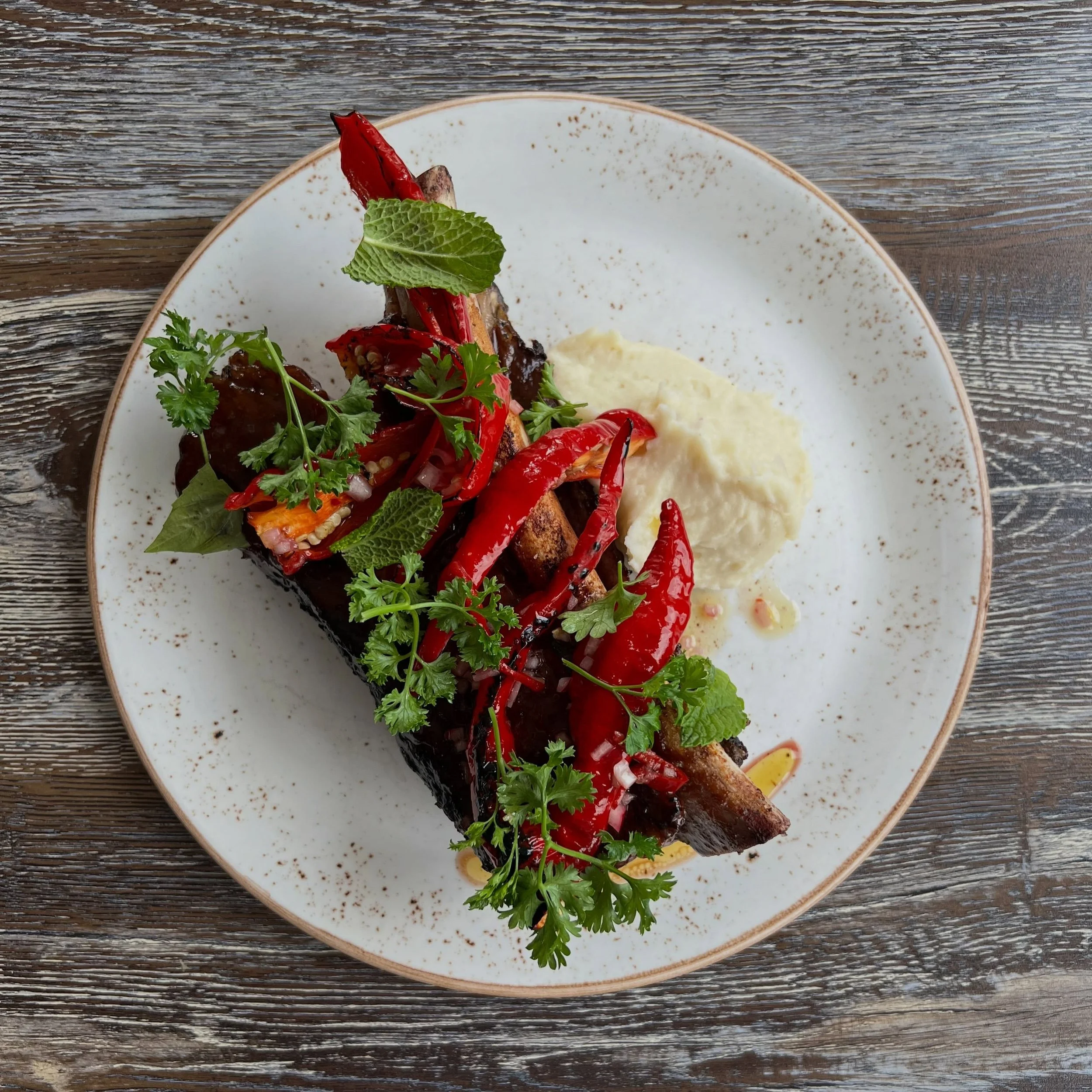 Special tonight! 37oz grilled bone-in beef rib, beer balsamic bbq, roasted shallot mashed potatoes, herb salad. 🥩🔥