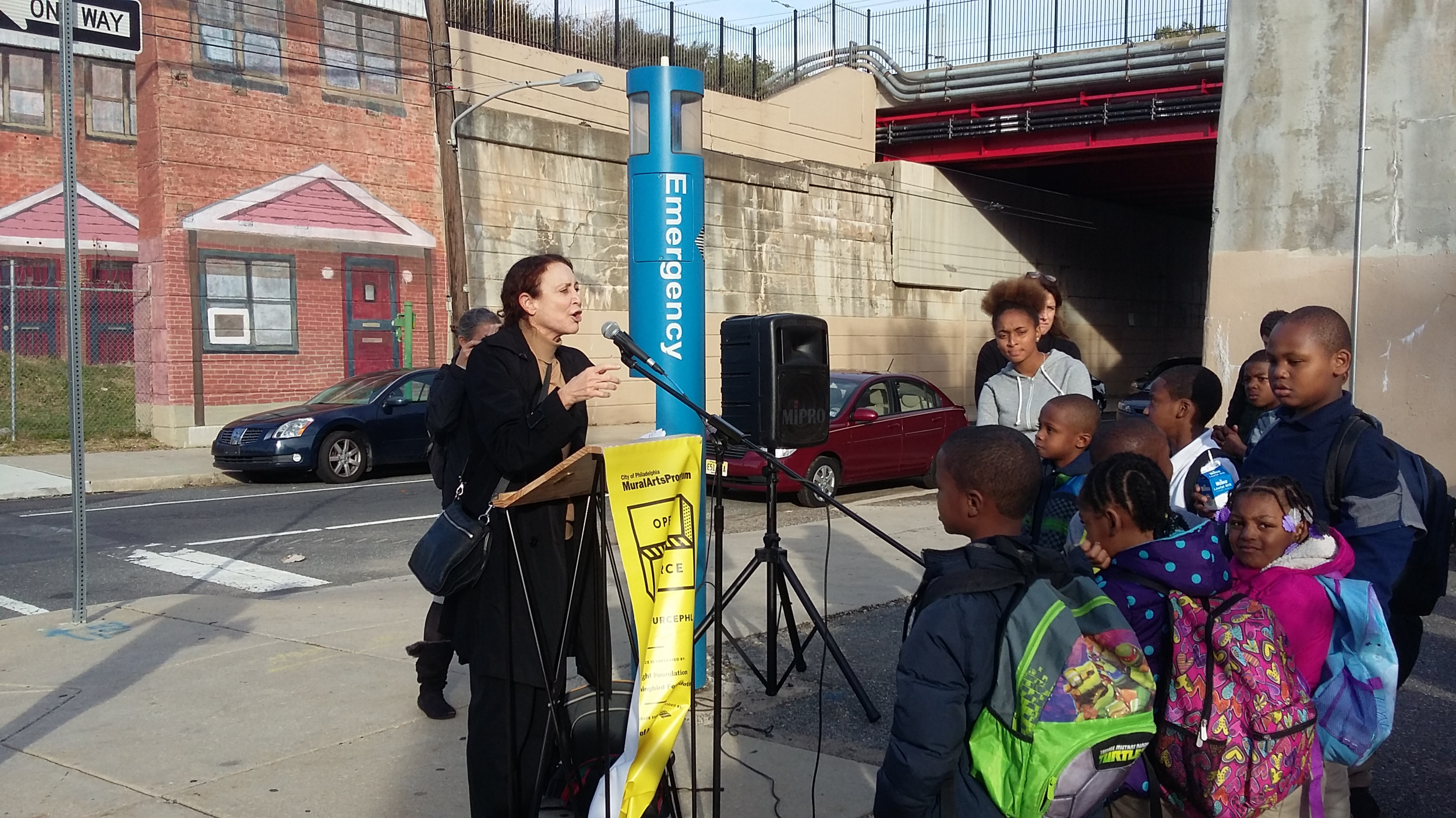 Naida  Burgos - Norris Homes Mural Dedication October 29, 2015 artist with kids.png