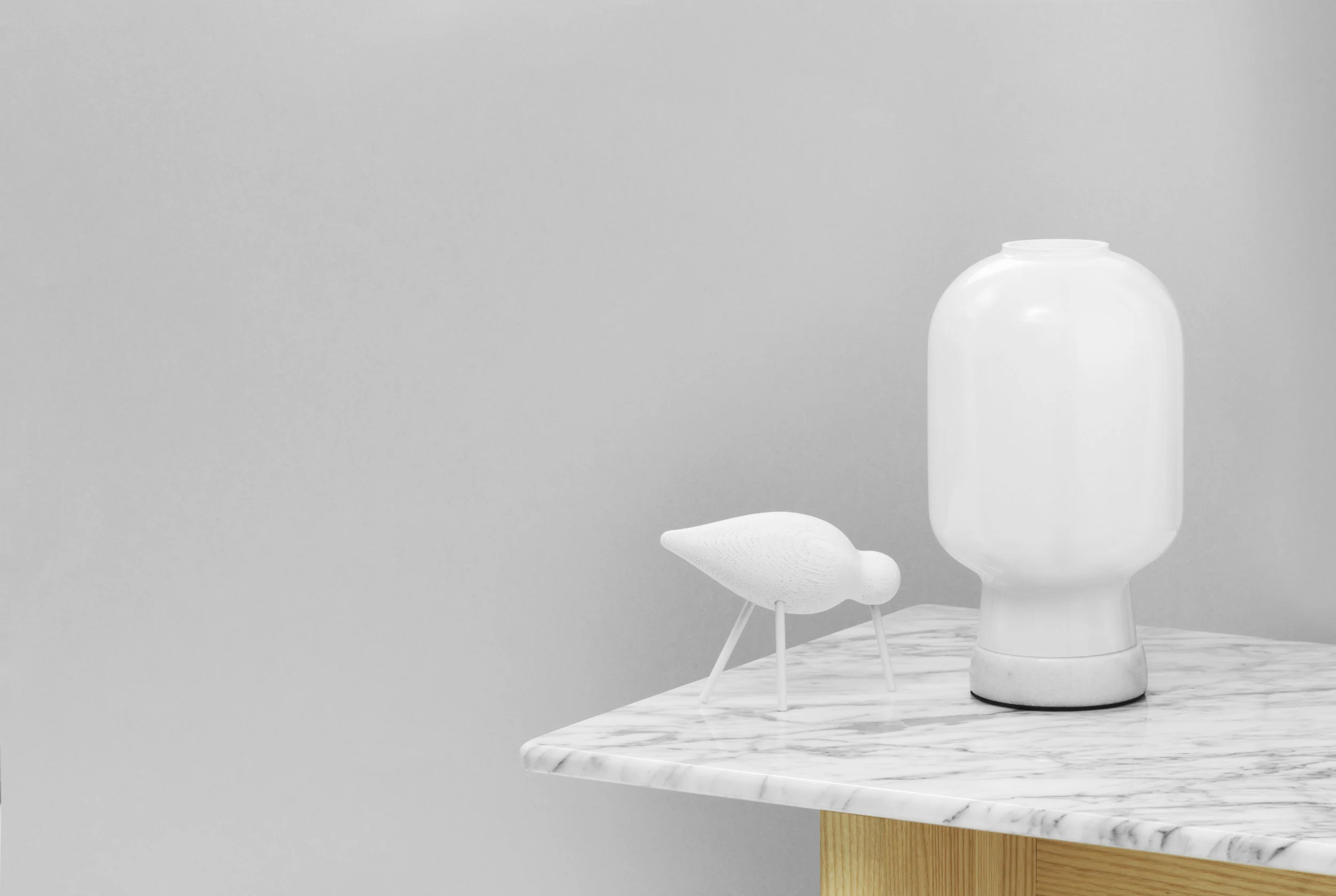 502075_Normann_Copenhagen_Amp_Table_Lamp_EU_WhiteWhite_On_Slid_Table.jpg