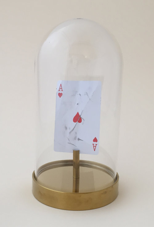 Glass dome with playing card