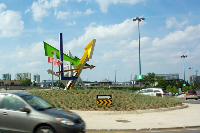 Possibilities by Michel de Broin, Mississauga, a sculpture of seven coloured arrows inspired by roadside signage from the golden age of the automobile. City of Mississauga Permanent Public Art Collection