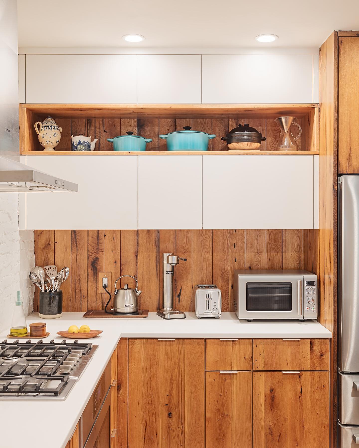 We love to mix high character grains with modern neutrals, seen here in our white oak kitchen at the Fulton Cedartop project. Sleek and homey all at once!