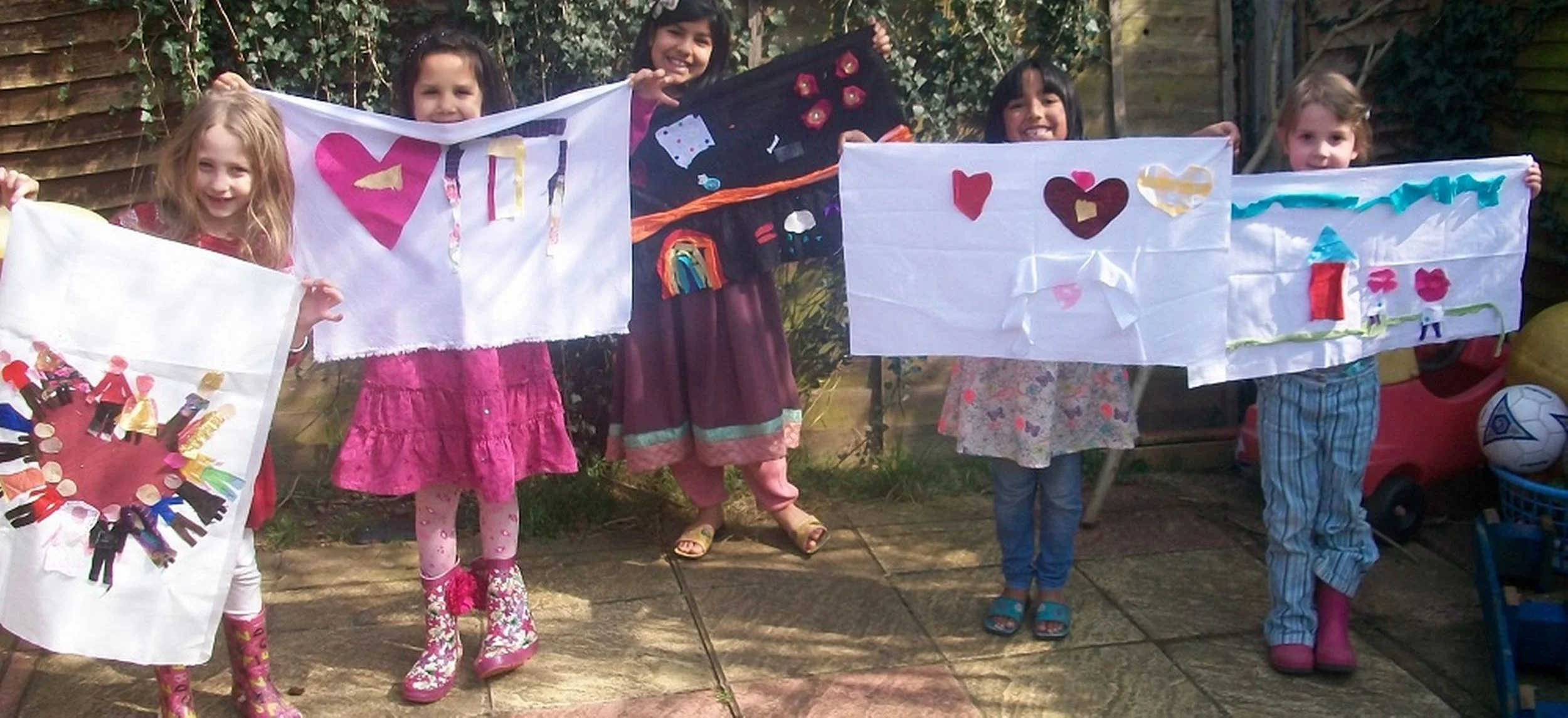 The children get ready to parade flags depicting their love for the villages