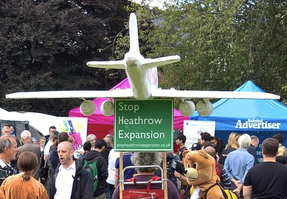 Just a normal day at the Maidenhead Festival - man with a plane on his head talks to bemused bear while watching the Prime Minister schmoozing the locals (yes that's her by the pink tent)