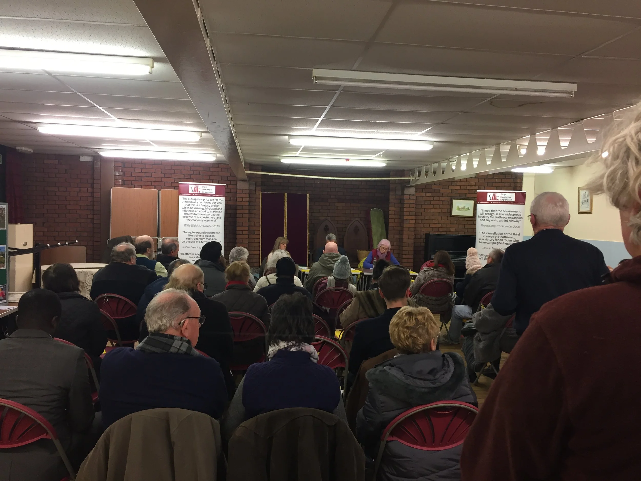 Residents in warm coats and woolly hats filled the village hall