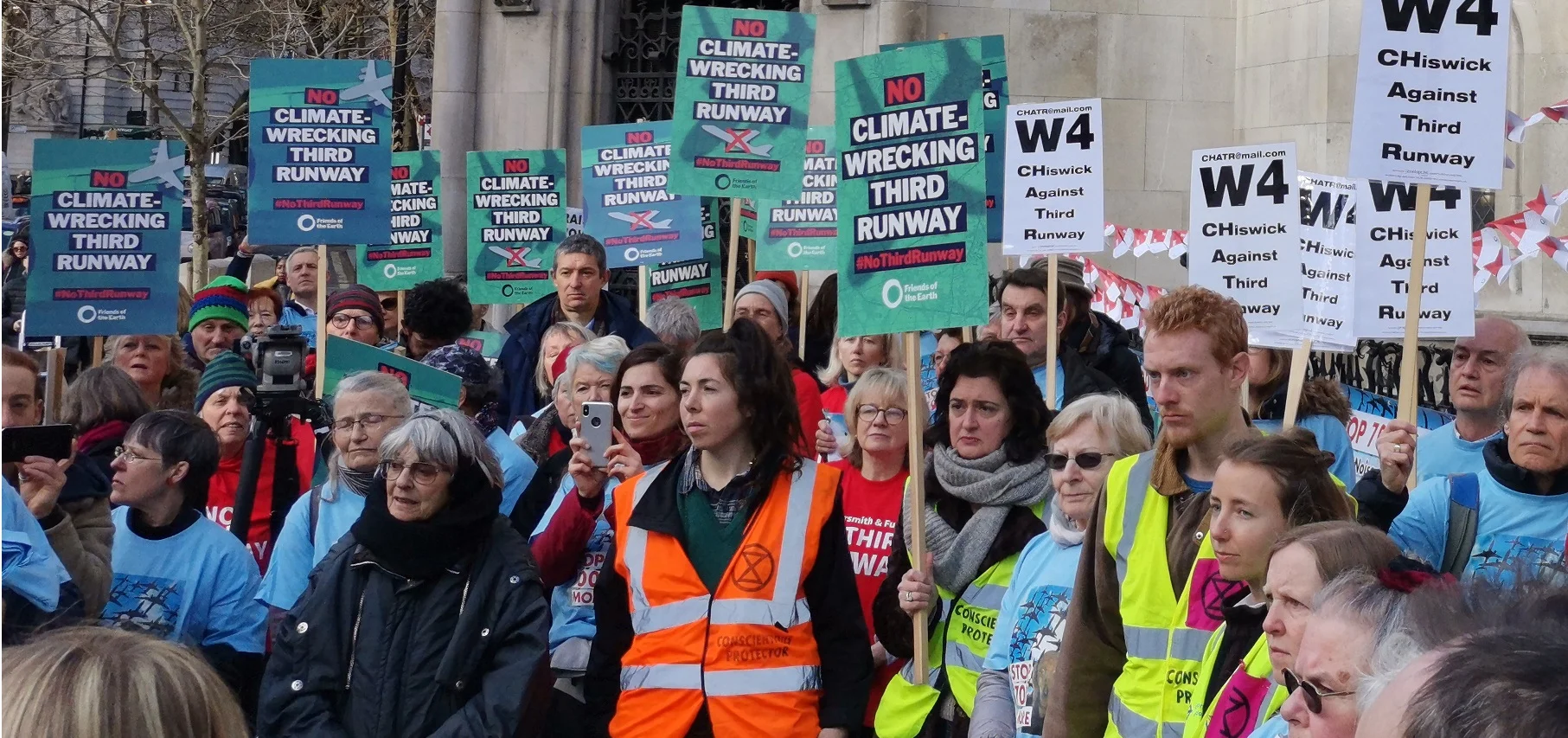 A few of the protesters listening to speeches outside the Courts this morning.
