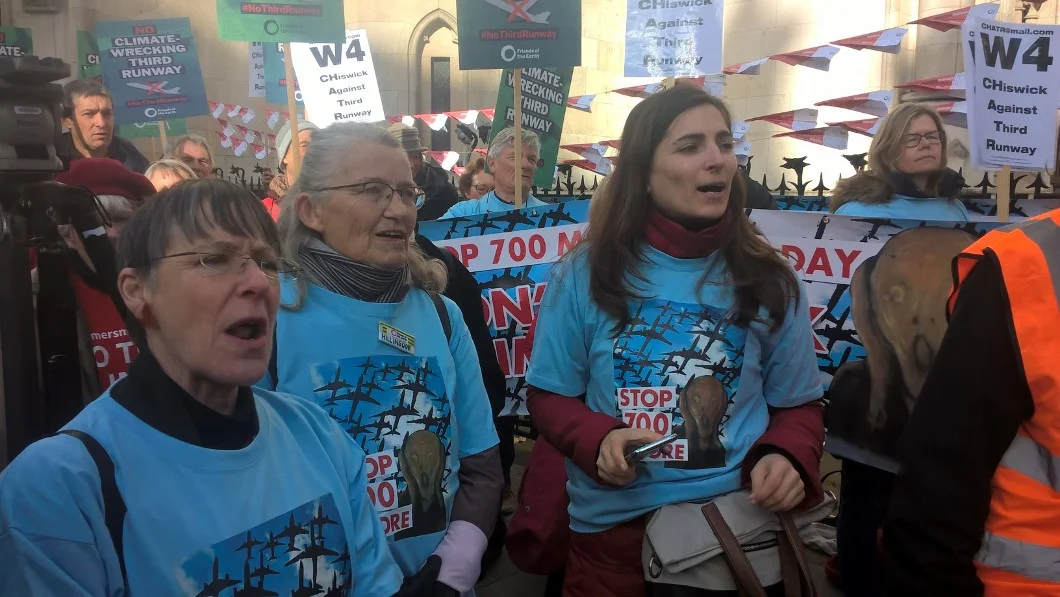 “Stop 700 More” flights a day Group Members and banners outside court today.