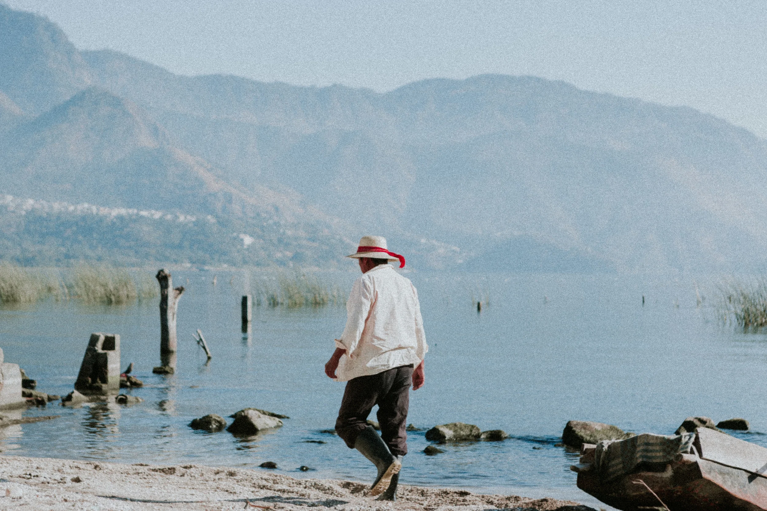 a fisherman walks to the docks in san juan at sunrise