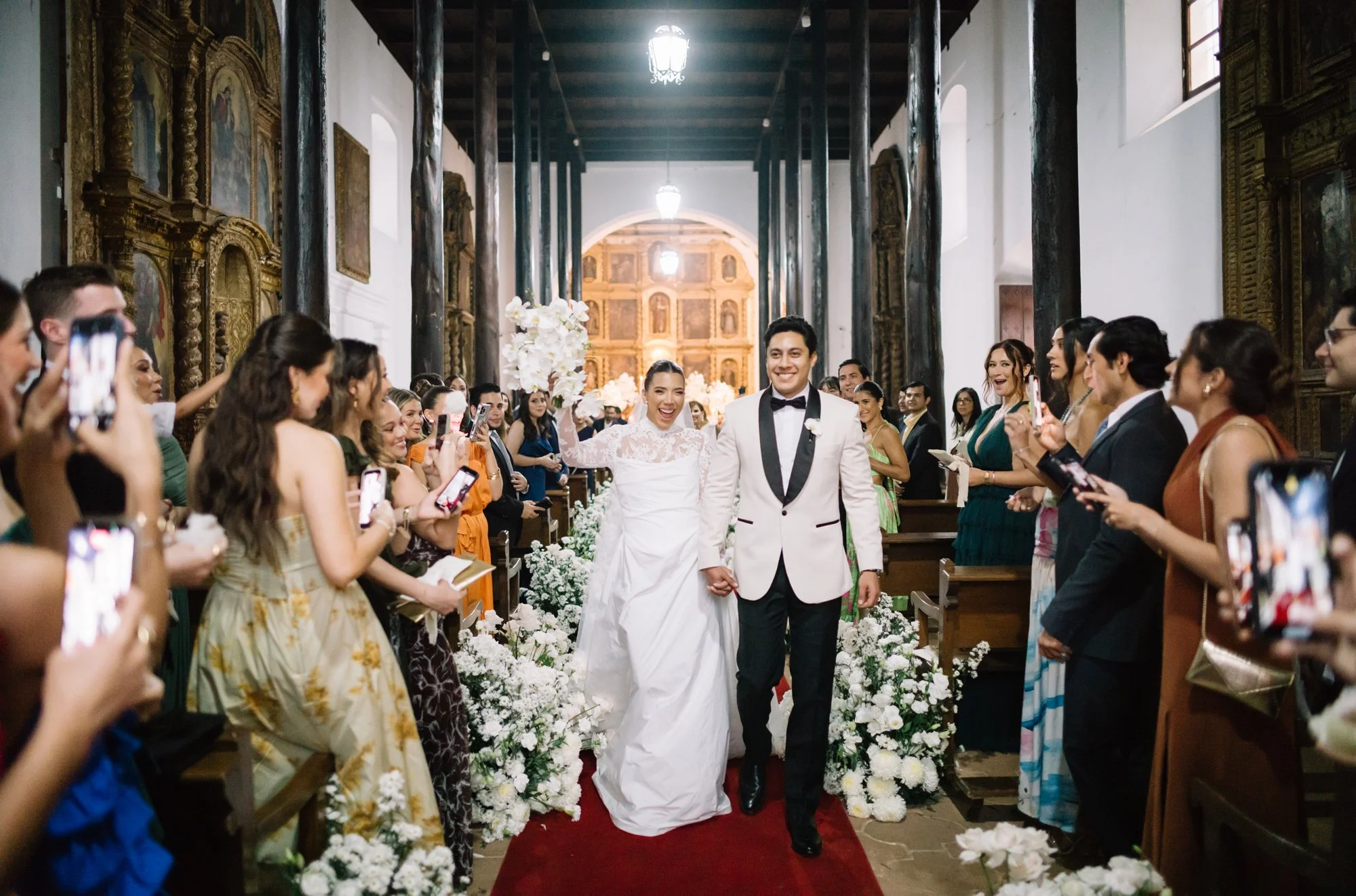 Bride and groom exiting the ceremony at San Juan del Obispo Church in Antigua Guatemala.