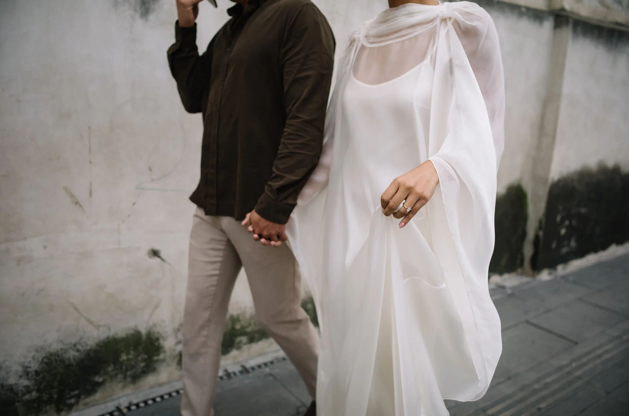 Couple exploring the historic streets of Antigua Guatemala before their destination wedding weekend.