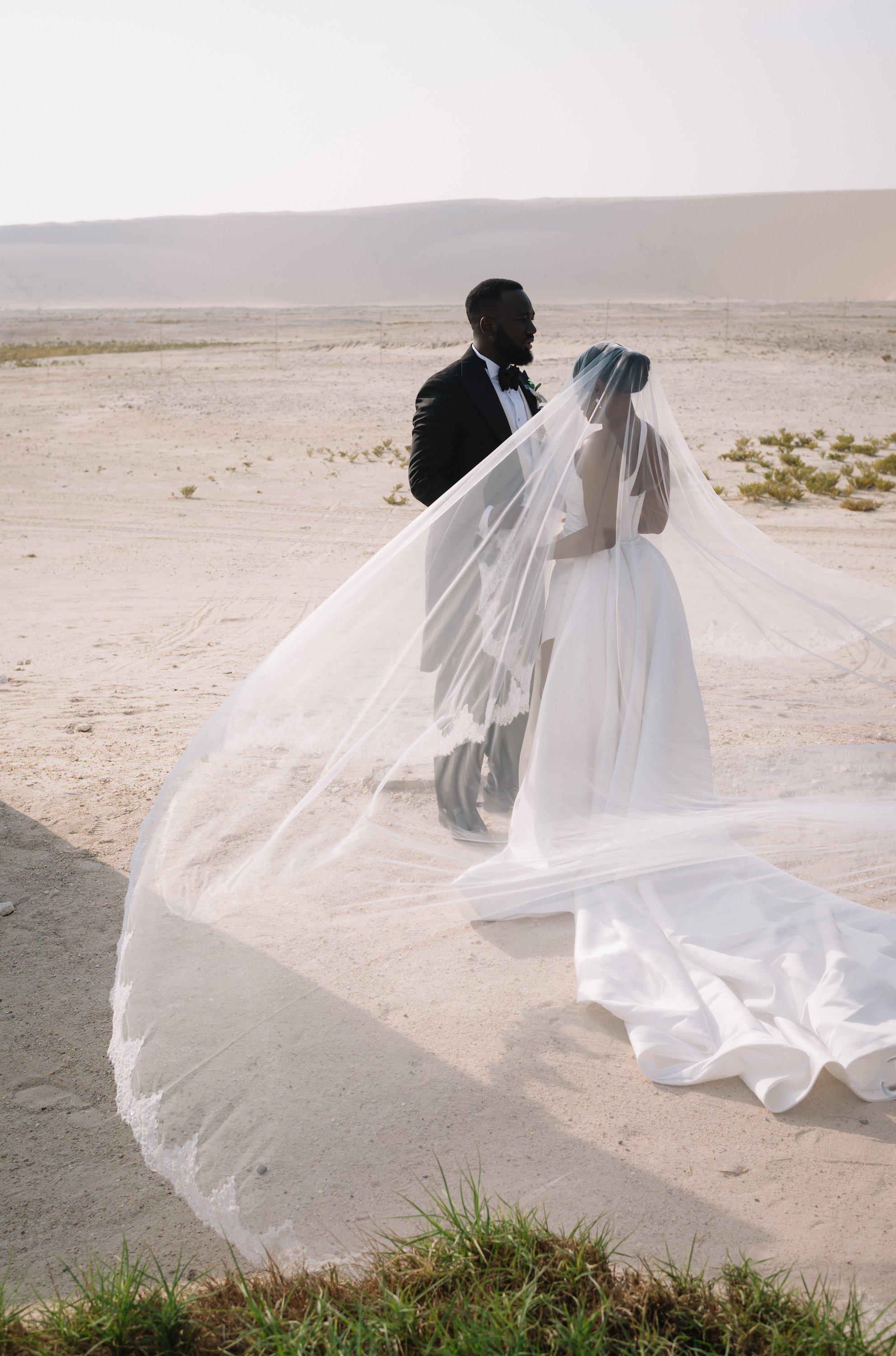 First look in the Qatar desert destination wedding photographer