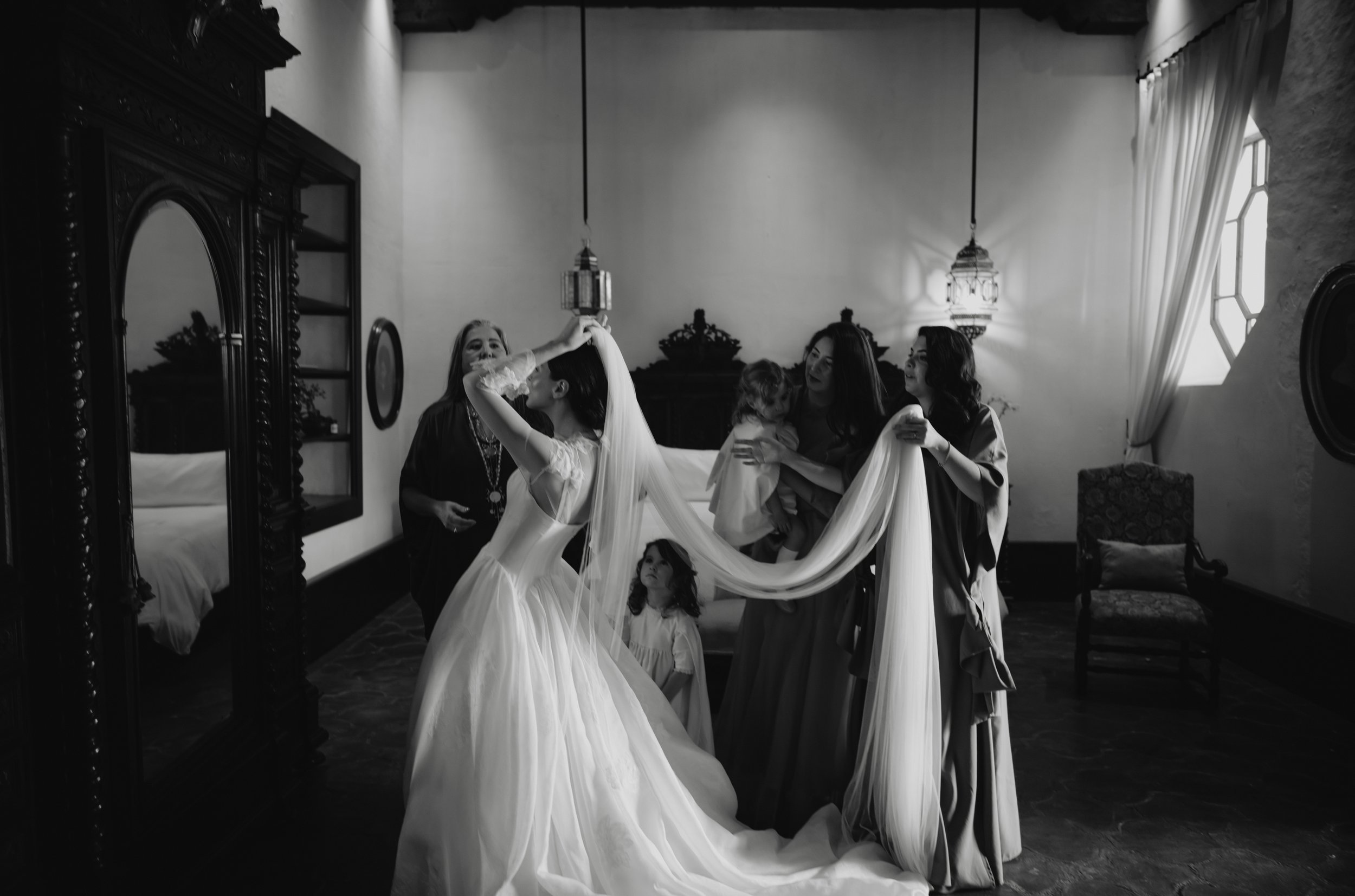 Bride in wedding dress inside Casa Tridentino