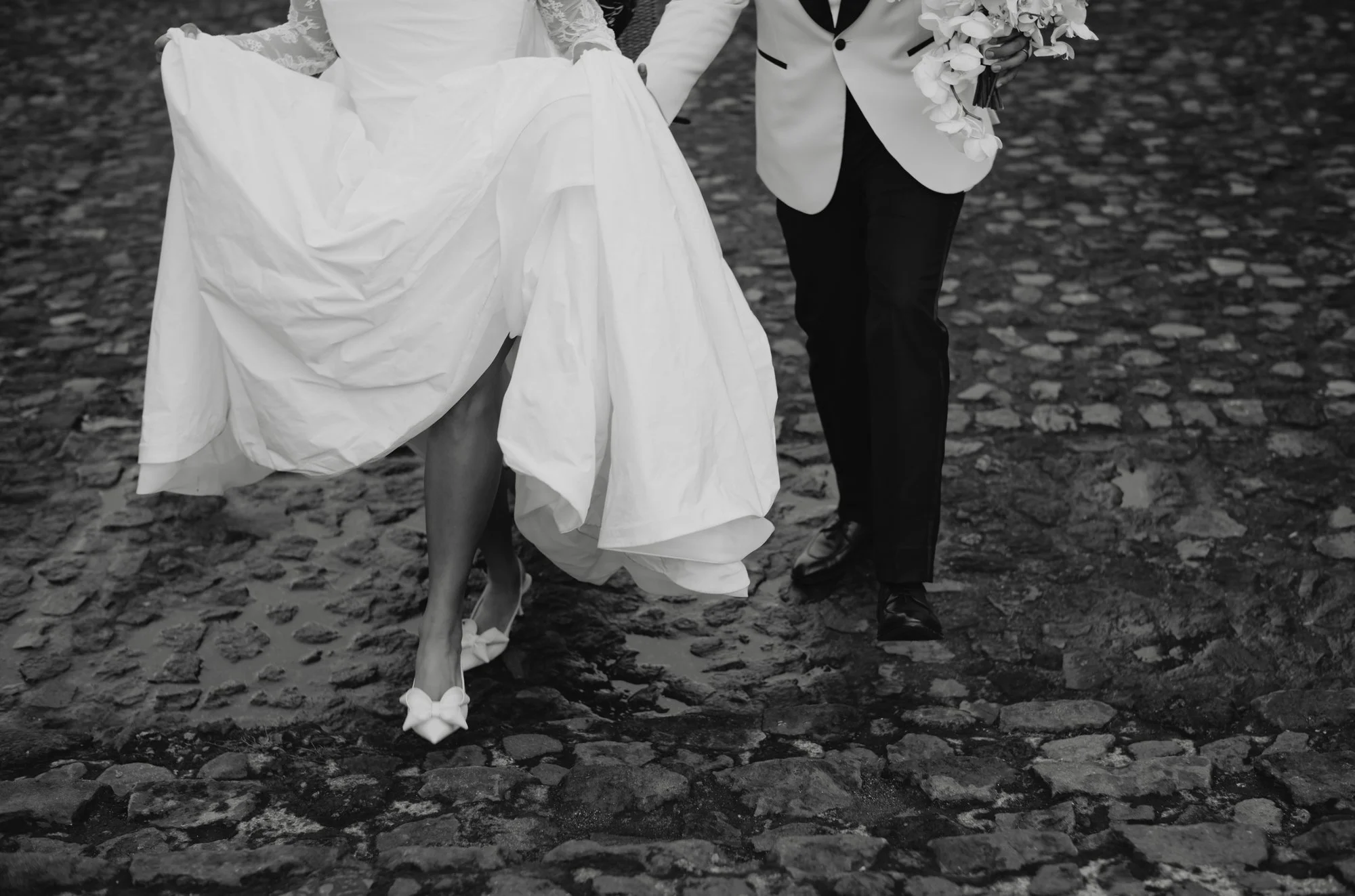 Cinematic wedding photography capturing a luxury destination wedding during rainy season in Antigua Guatemala.