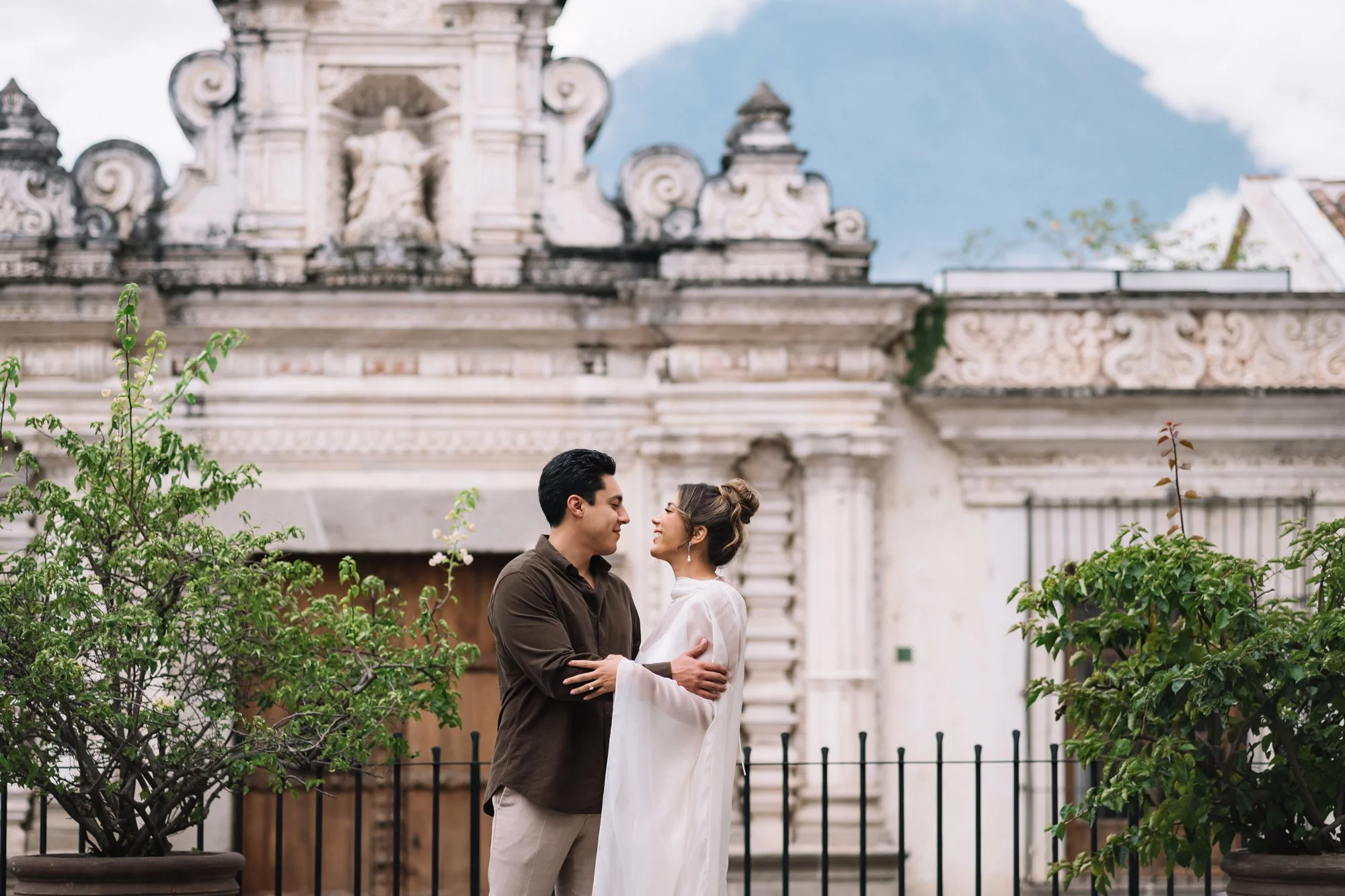 Bride and groom portraits outside the Antigua Guatemala Cathedral during a luxury destination wedding.