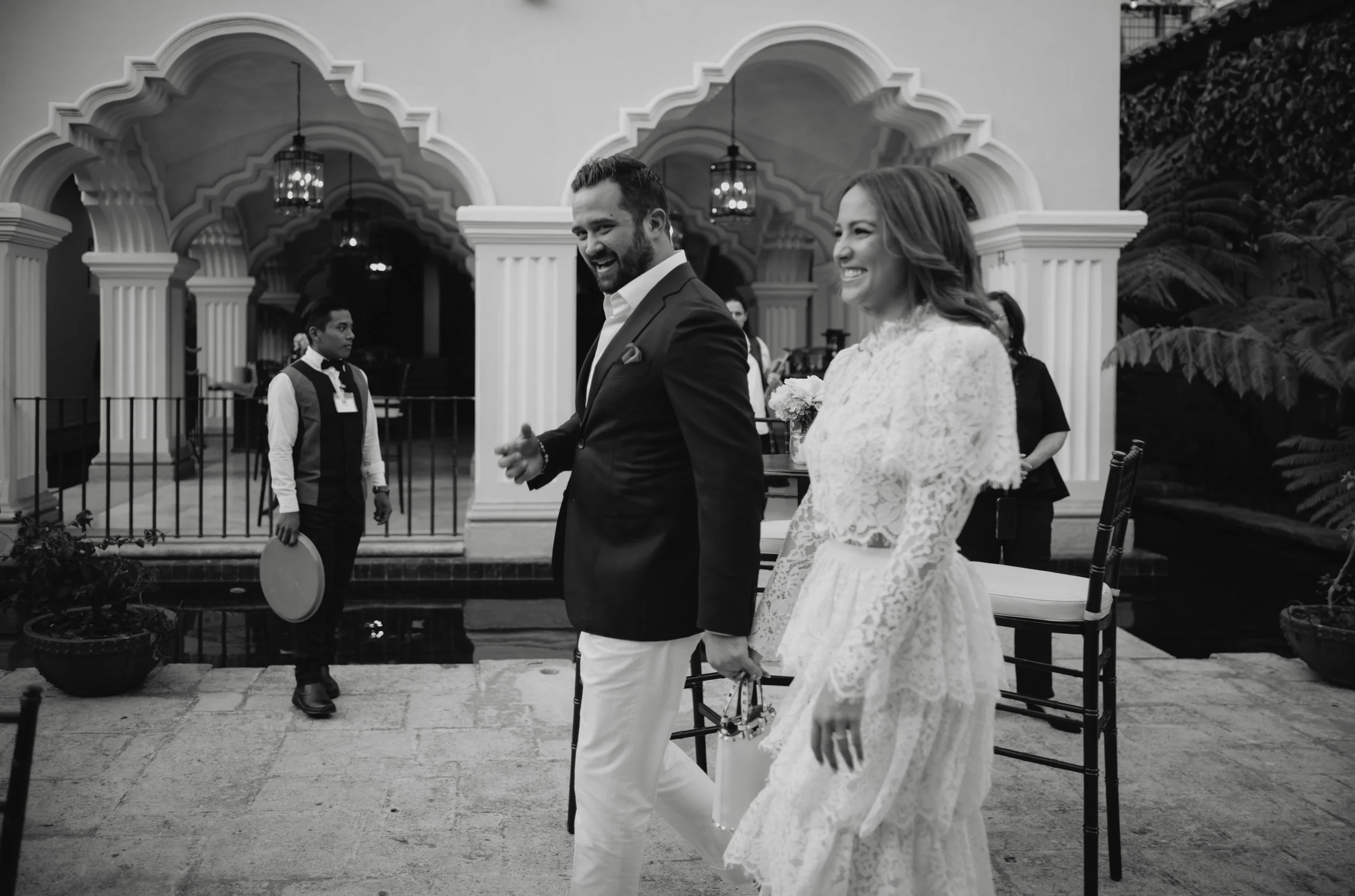 Bride and groom arriving to the outdoor welcome party Pensativo House Antigua Guatemala
