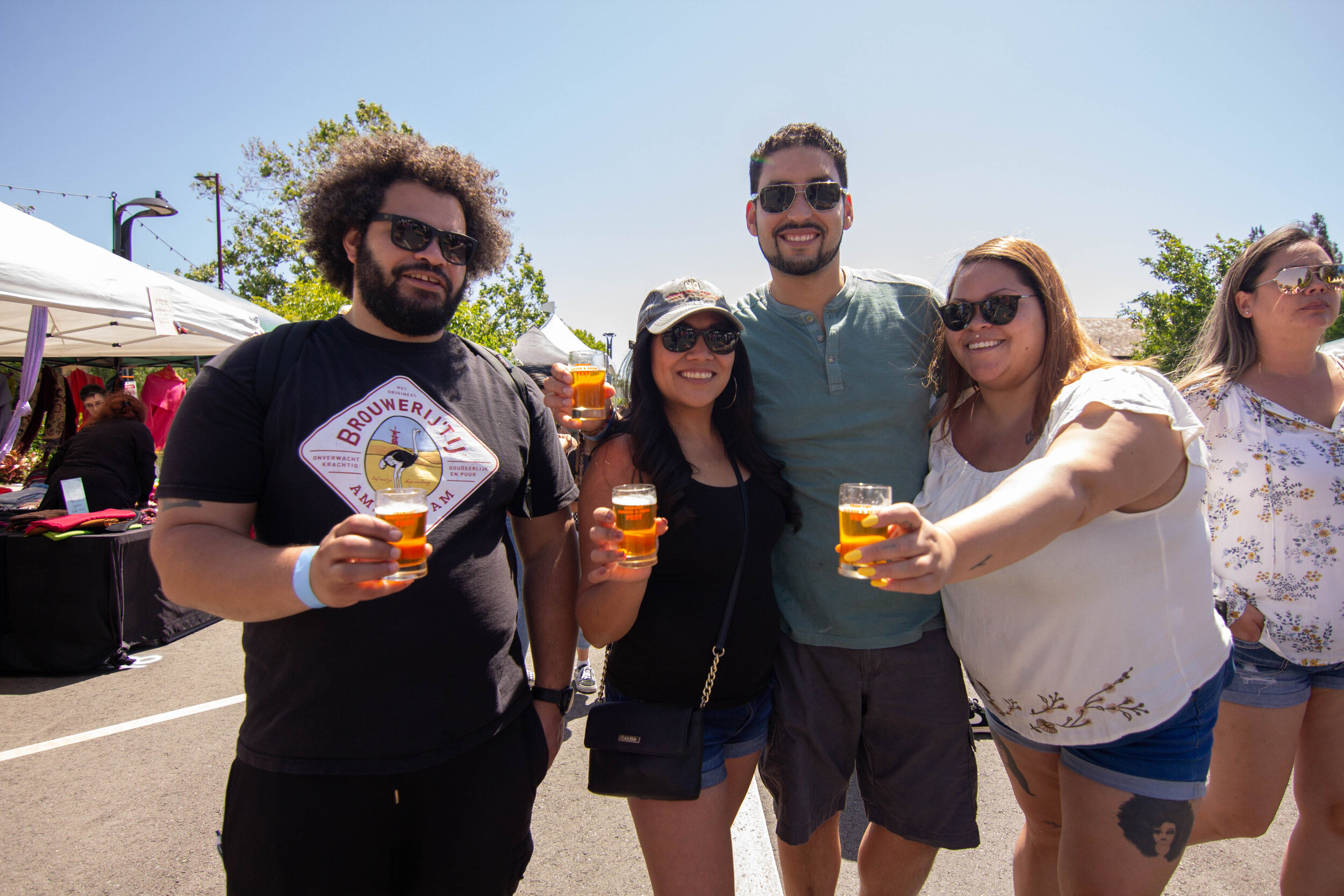 BnB2019-132 h 4 friends hold glasses.jpg