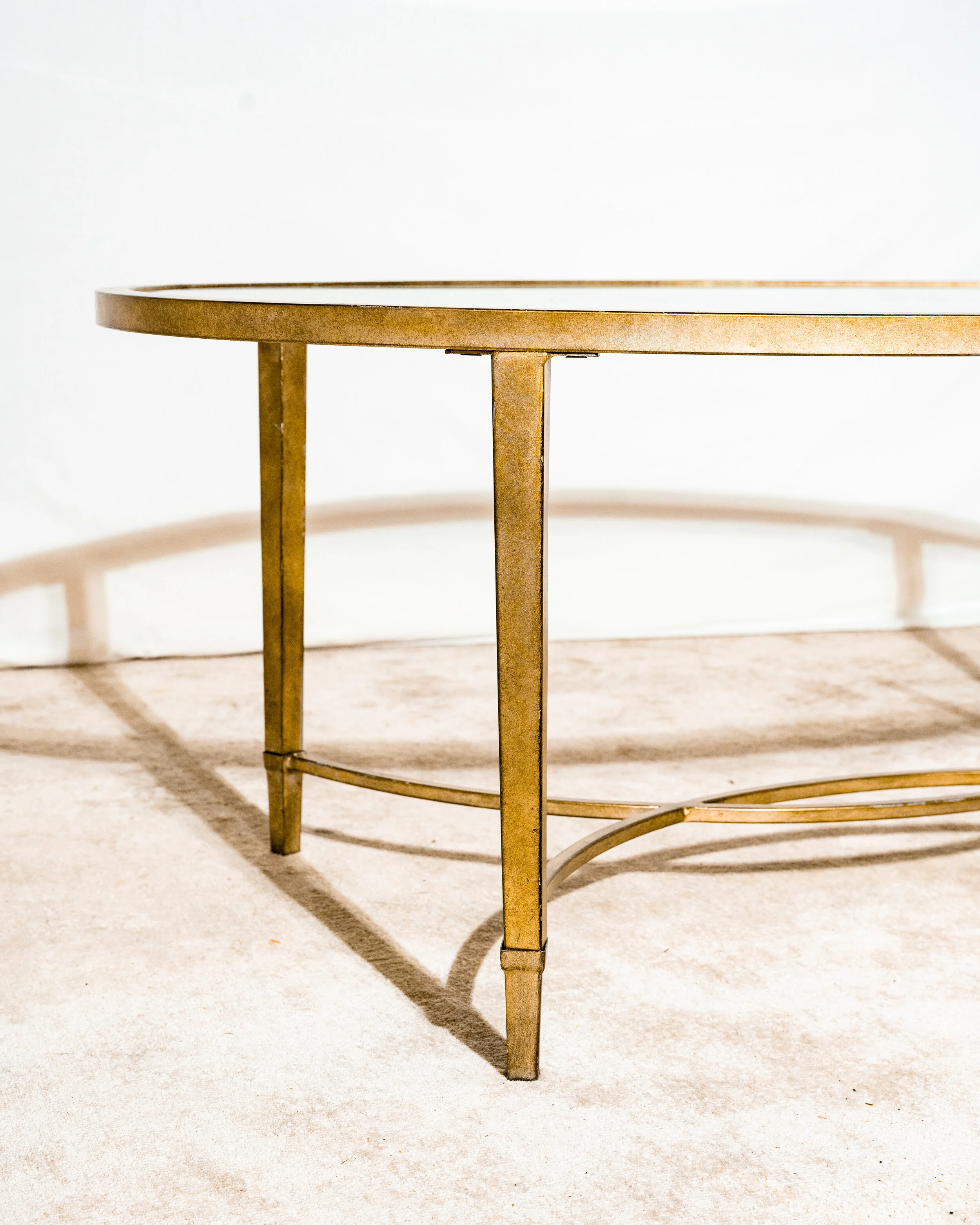 OVAL GLASS GOLD TABLE
