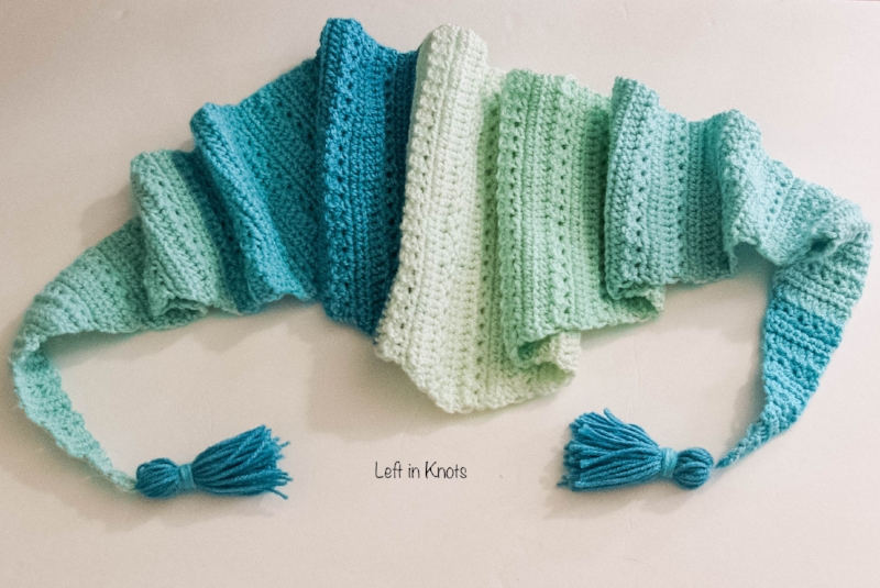 The Snow Drops Mod Scarf is a modern one skein triangle scarf that highlights the stunning texture of the star stitch. You can make this free crochet pattern with just one skein of Caron Cakes yarn or with any worsted weight yarn you have in your stash