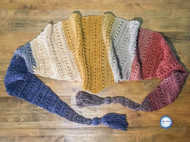 The Crunching Leaves Mod Scarf features all the best warm fall tones with just one cake of Lion Brand Mandala yarn! This trendy triangle scarf will keep you warm all fall and winter long. Read more for the free crochet pattern.