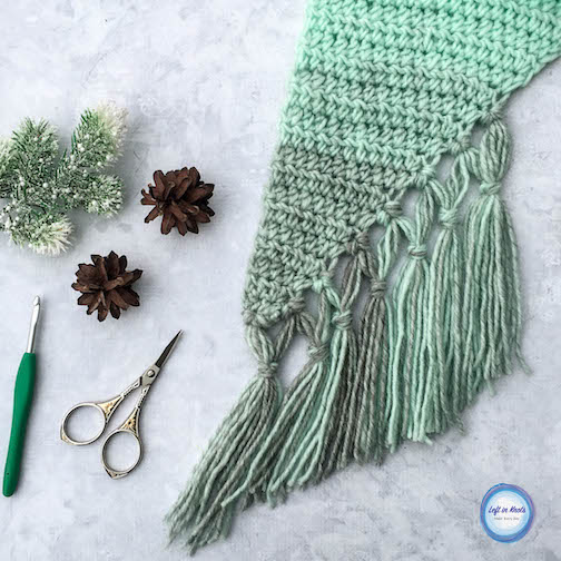 The Mint-cicle Scarf is a free, beginner-friendly crochet pattern with a modern twist. It takes just one skein of Lion Brand Scarfie yarn and it will be a perfect addition to your last-minute gift list this holiday season! It is the first free crochet pattern of my Seven Days of Scarfie pattern collection.