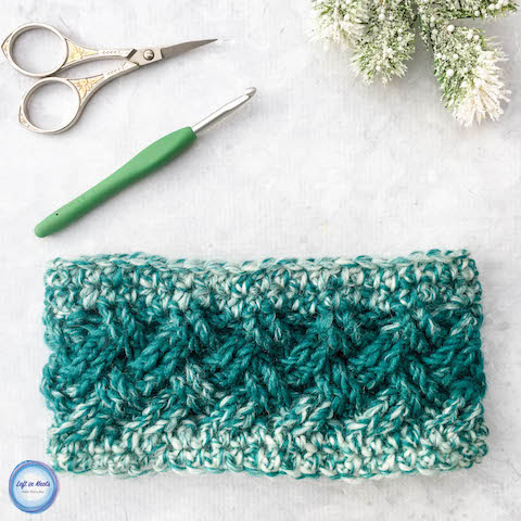 The color gradient of Lion Brand Scarfie yarn plus the elegant texture of the Celtic weave stitch make this ear warmer a quick and stunning piece! The Celtic Winters Ear Warmer takes less than one skein of Lion Brand Scarfie yarn and will be a perfect addition to your last-minute gift list this holiday season! It also matches the Celtic Winters Cowl that I designed last year so you can make a nice matching set :) This is the fourth free crochet pattern of my Seven Days of Scarfie pattern collection.