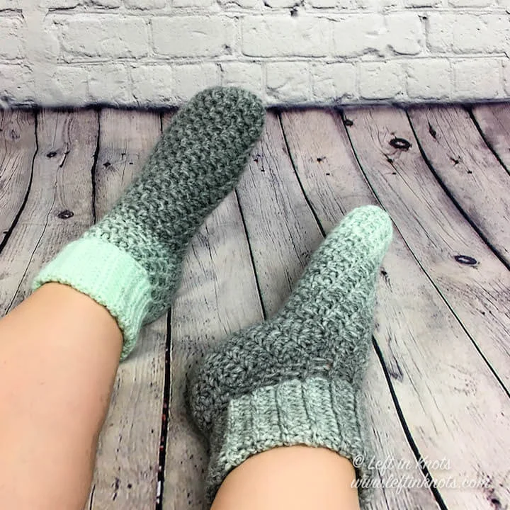 Use the rest of your Seven Days of Scarfie “Day 4” skein to crochet these coziest slipper socks! Or you may as well grab a couple of skeins, because you will want a few pairs of these for yourself too :) This free crochet pattern makes the Wintermint Slipper Socks in three sizes that will fit most adult women. The cuffed ankle keeps them in place, and the ever fuzzy Scarfie yarn will keep your feet warm for days!