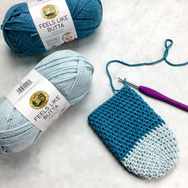 This free crochet pattern uses less that one skein of yarn to make easy crochet slipper socks. Use Lion Brand Ferris Wheel yarn to create a beautiful colorful gradient in brights or neutrals. Or if you prefer, substitute your favorite Category 3 yarn and make these simple slippers in easily adjustable sizes.