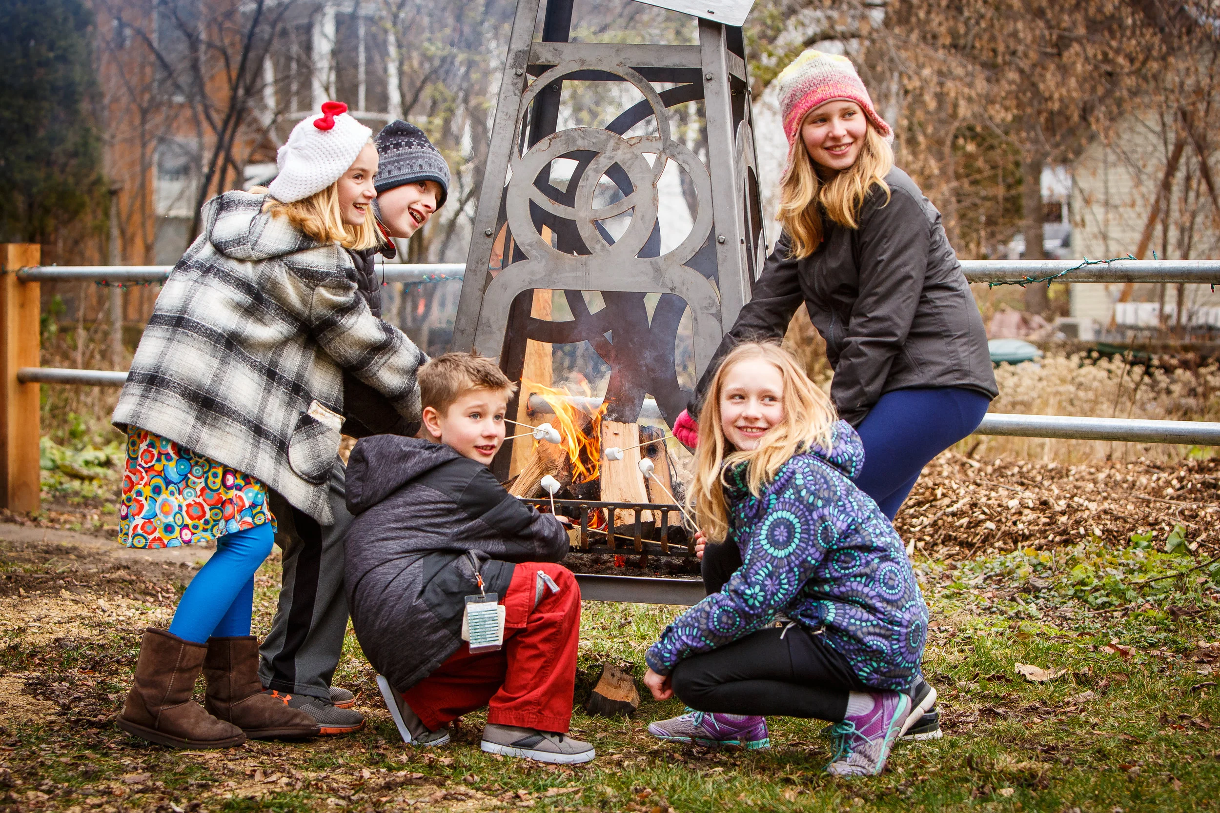kids roasting marshmallows camp fire grate-4558.jpg
