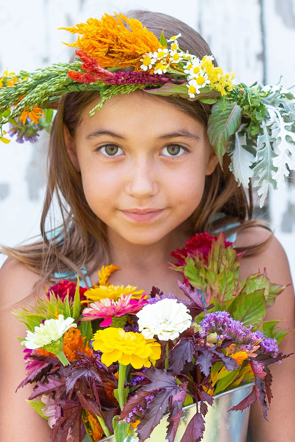 girl-wearing-floral-wreath-holding-flowers-5052-sp.jpg