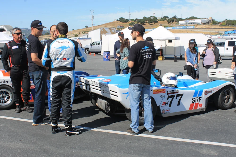 Kanga Motorsports James Chartres Talking in Paddock.JPG
