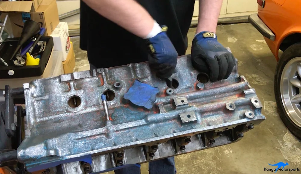 Kanga Motorsports Datsun 240z Engine Build Removing Engine Block Paint and Rust Wire Brush Scrubbing.jpg