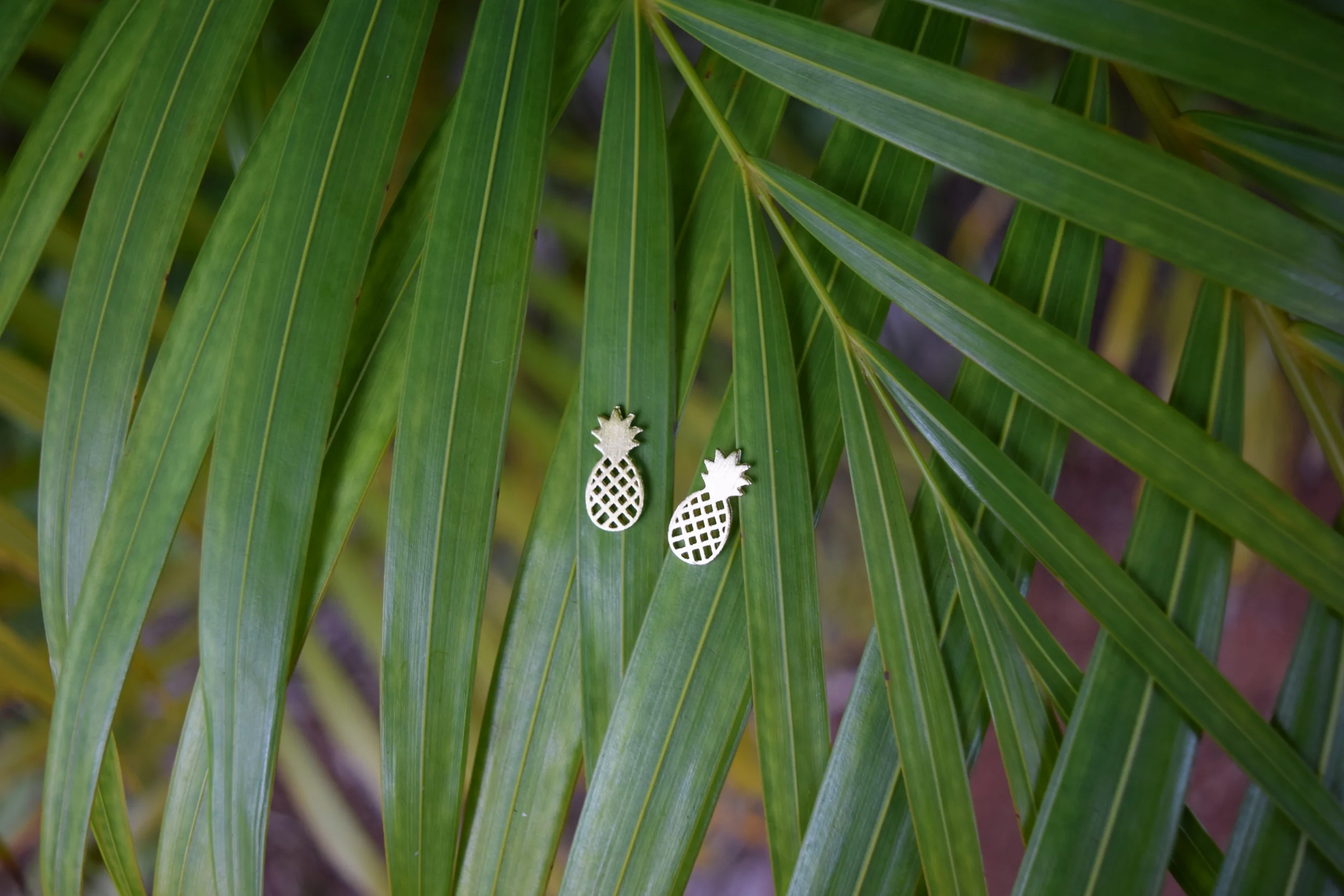 Pineapple jewelry? Yes please! We've got you covered. We have different styles of pineapple jewelry, but featured here are among our most popular. We have them in gold, rose gold, and silver.