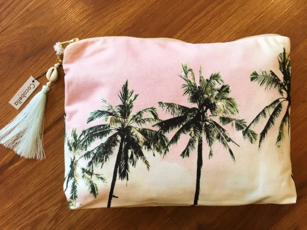 By Cocobella. This size is the "pouch" size. It can hold your iPad, or makes for the perfect beach accessory. 