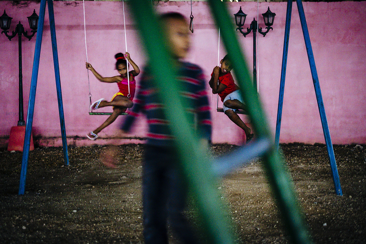 Kids play at a public playground in Centro Havana. 