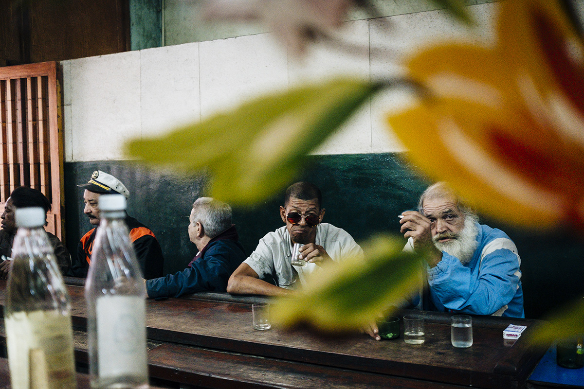  Cubans drink and smoke in a bar in Centro Havana. 