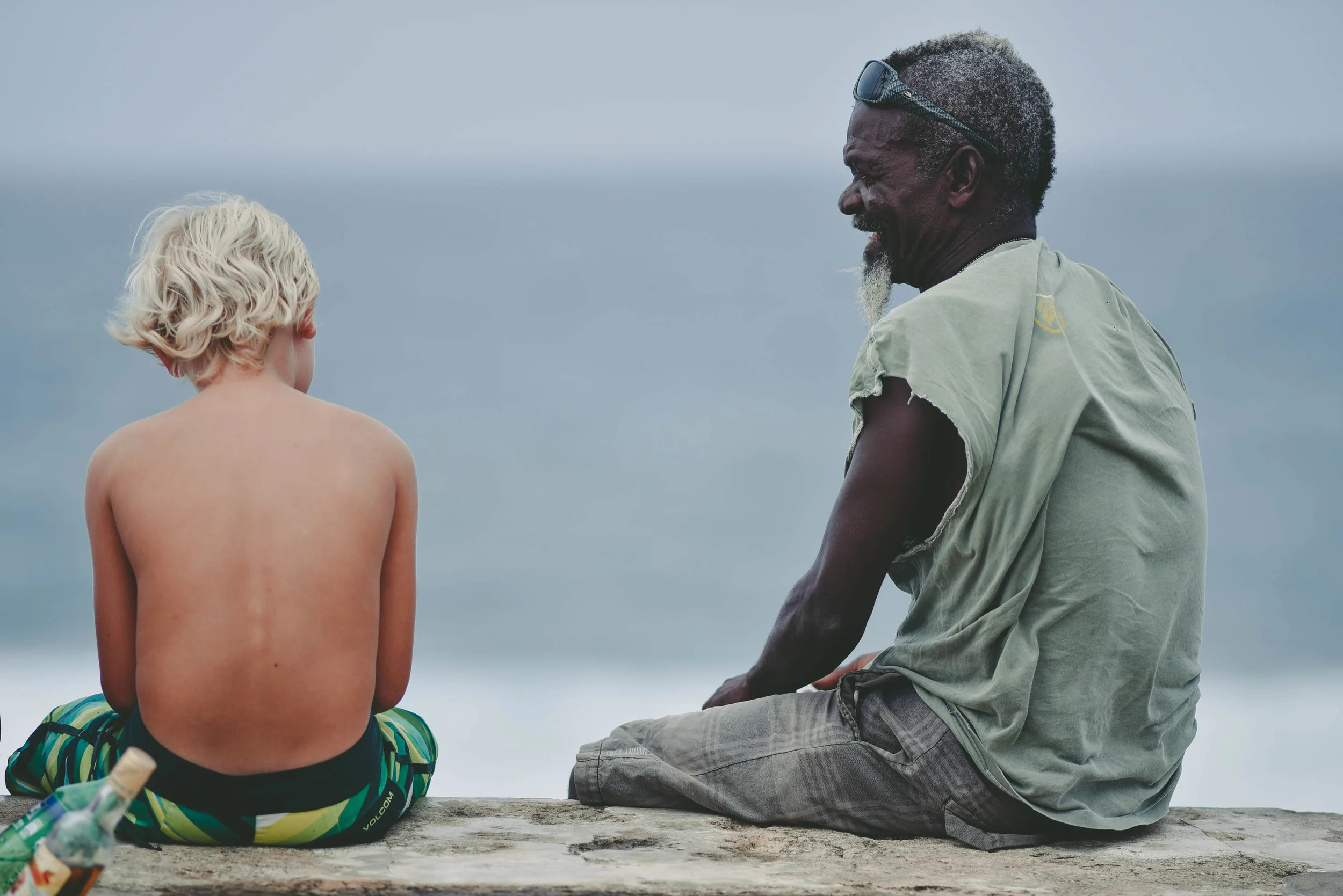 Snake, also considered the founding father of Barbados surfing, here chatting with a young surfer in Bathsheba