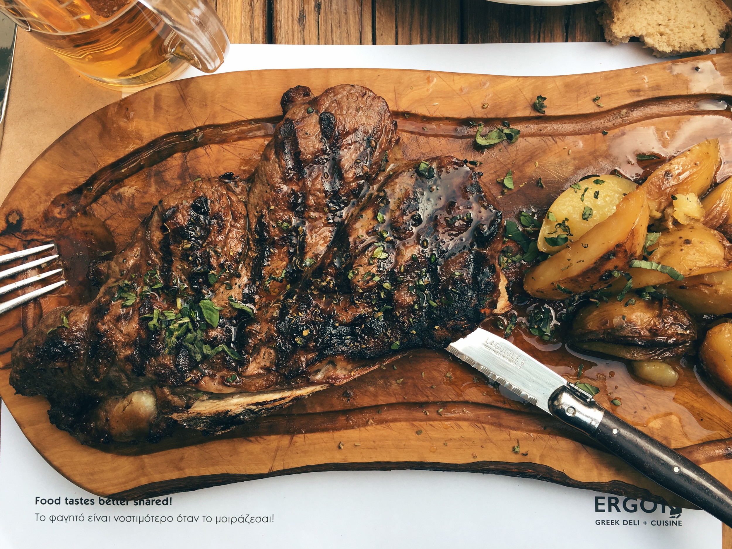 Rib-eye steak with oven potatoes, served with a touch of truffle oil. Served at Ergon